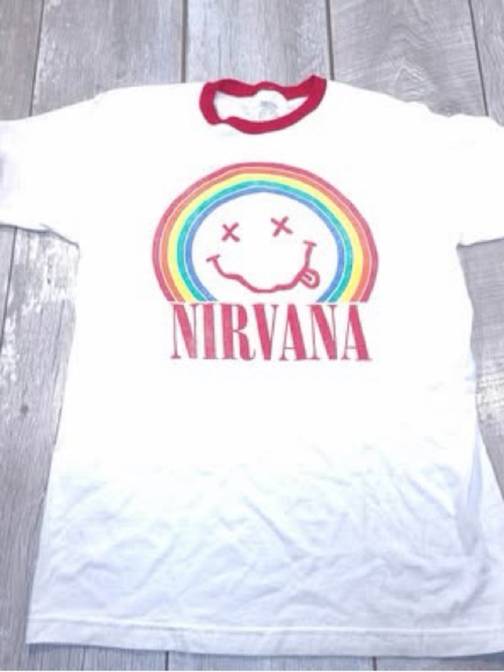 Nirvana unisex rainbow face on white shirt. Red trim
Size medium